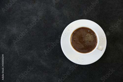 cup of coffee on black background. Coffee concept. Background, menu. With copy space for text. Flat lay. Top view.
