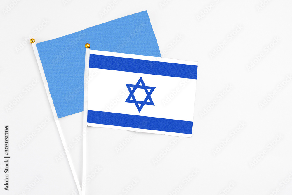 Israel and Somalia stick flags on white background. High quality fabric, miniature national flag. Peaceful global concept.White floor for copy space. Israel and Somalia stick flags on white background. High quality fabric, miniature national flag. Peaceful global concept.White floor for copy space.