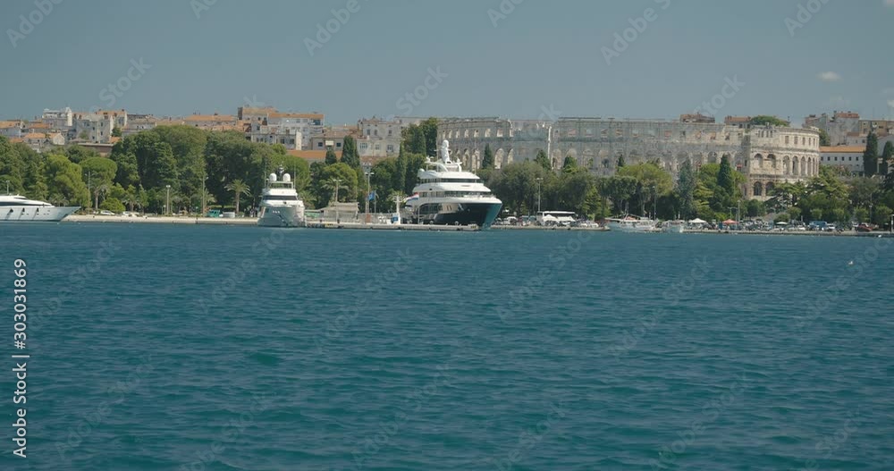 View from an approaching ship towards Pula Arena, Croatia, handheld View from an approaching ship towards Pula Arena, Croatia, handheld
