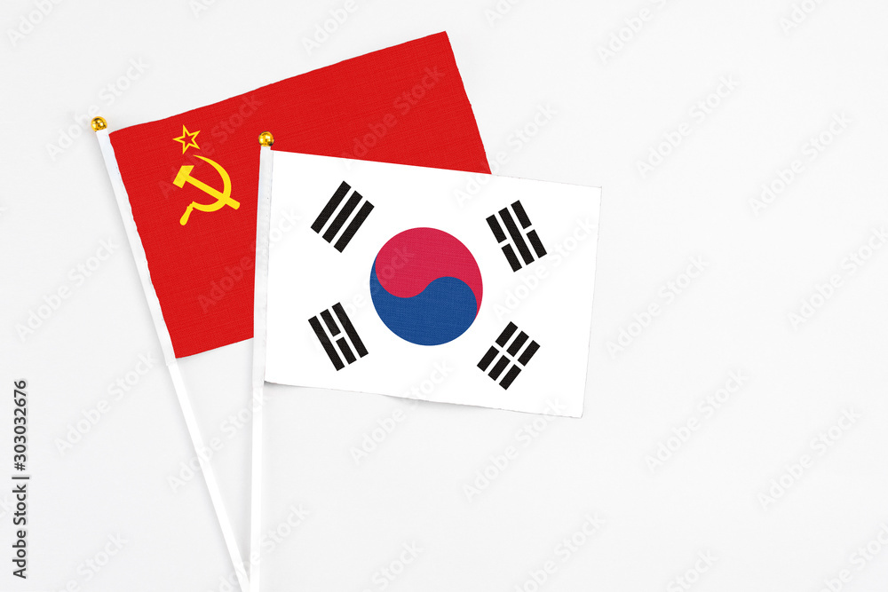 South Korea and Soviet Union stick flags on white background. High quality fabric, miniature national flag. Peaceful global concept.White floor for copy space.