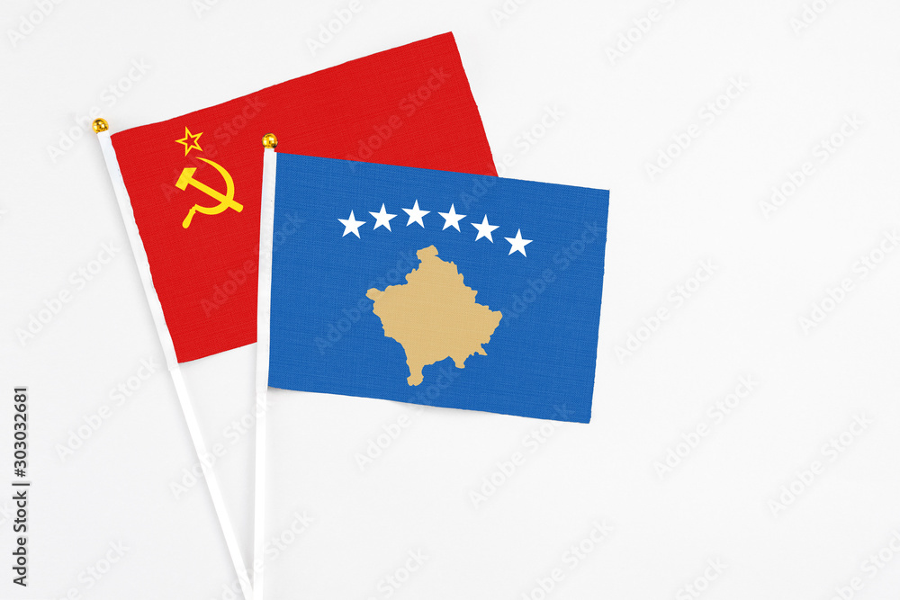 Kosovo and Soviet Union stick flags on white background. High quality fabric, miniature national flag. Peaceful global concept.White floor for copy space. Kosovo and Soviet Union stick flags on white background. High quality fabric, miniature national flag. Peaceful global concept.White floor for copy space.