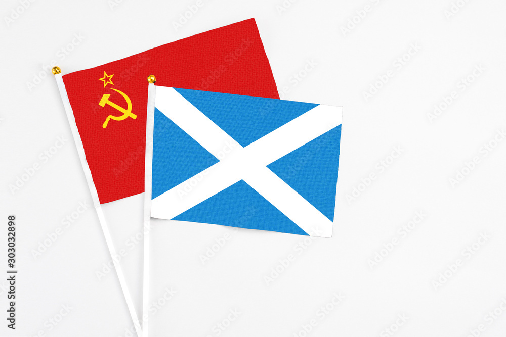 Scotland and Soviet Union stick flags on white background. High quality fabric, miniature national flag. Peaceful global concept.White floor for copy space. Scotland and Soviet Union stick flags on white background. High quality fabric, miniature national flag. Peaceful global concept.White floor for copy space.