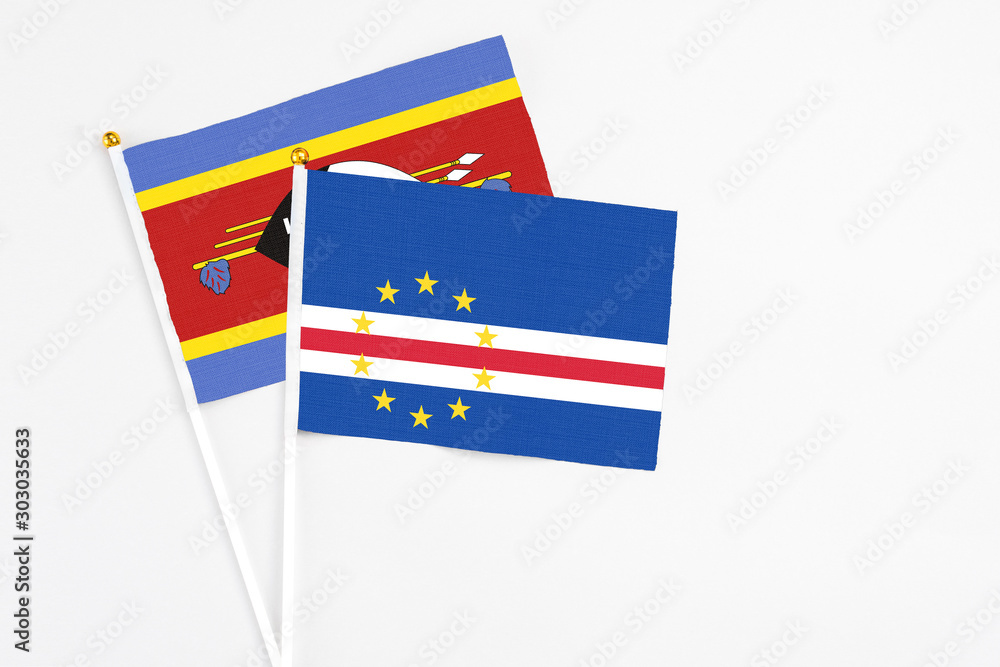 Cape Verde and Swaziland stick flags on white background. High quality fabric, miniature national flag. Peaceful global concept.White floor for copy space. Cape Verde and Swaziland stick flags on white background. High quality fabric, miniature national flag. Peaceful global concept.White floor for copy space.