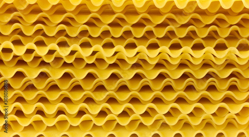 Wavy sheets for lasagna. From durum wheat. Close up. Isolated on white background