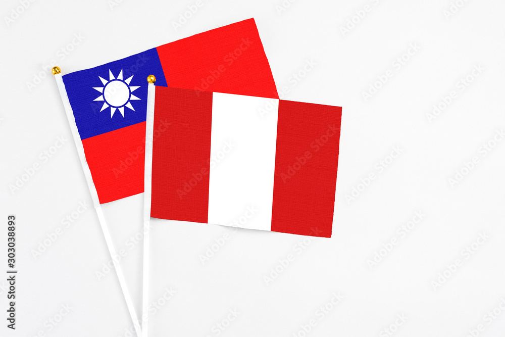 Peru and Taiwan stick flags on white background. High quality fabric, miniature national flag. Peaceful global concept.White floor for copy space. Peru and Taiwan stick flags on white background. High quality fabric, miniature national flag. Peaceful global concept.White floor for copy space.