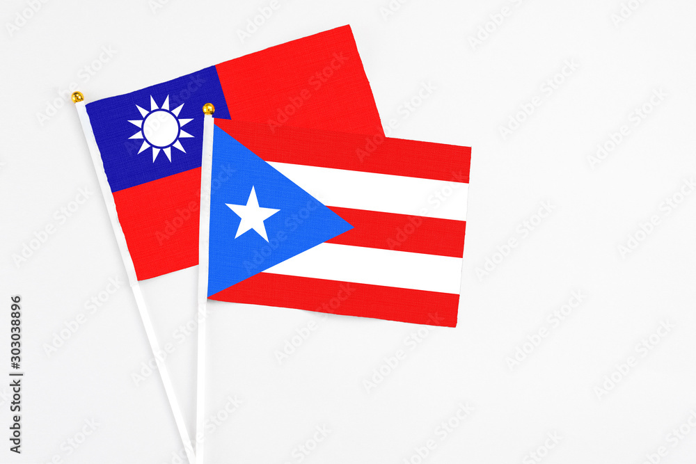 Puerto Rico and Taiwan stick flags on white background. High quality fabric, miniature national flag. Peaceful global concept.White floor for copy space.