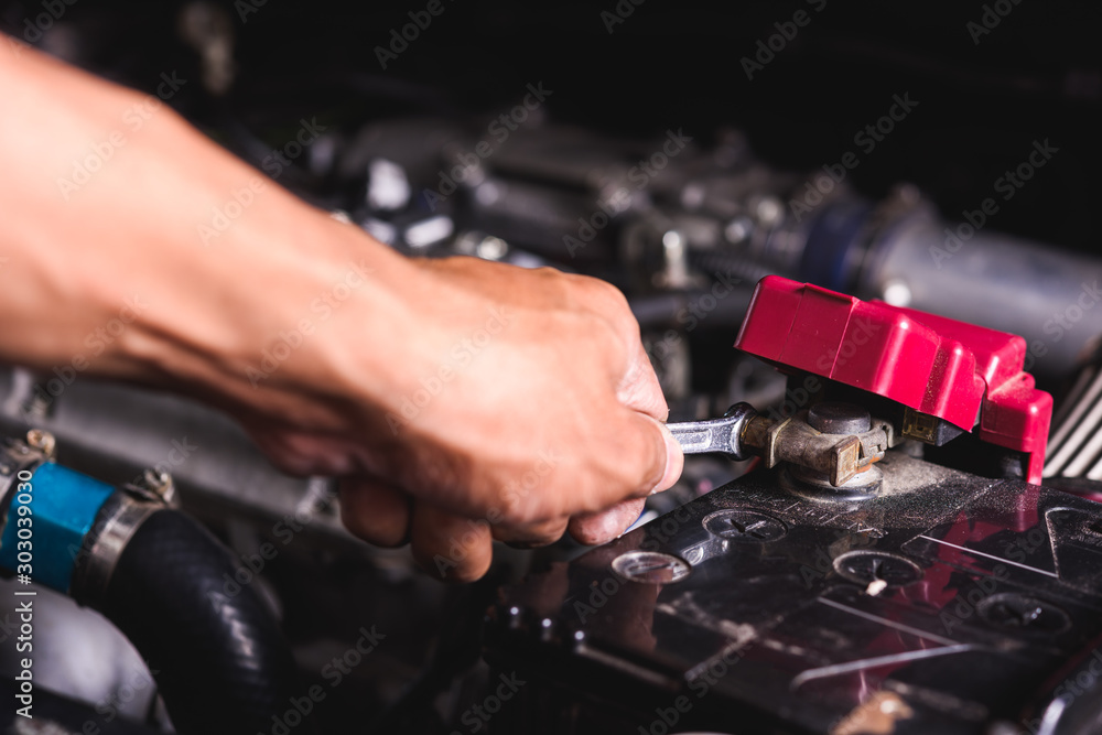 Hand of technician service check battery Hand of technician service check battery