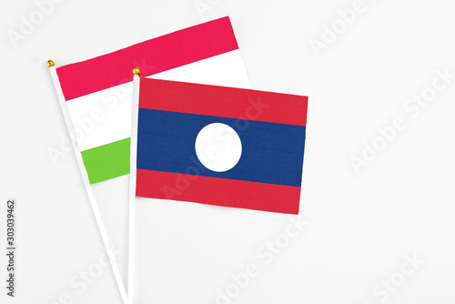 Laos and Tajikistan stick flags on white background. High quality fabric, miniature national flag. Peaceful global concept.White floor for copy space. Free Download Laos and Tajikistan stick flags on white background. High quality fabric, miniature national flag. Peaceful global concept.White floor for copy space. - GFXLoad