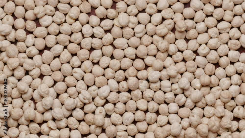 Group of raw chickpeas rotating in а circle Group of raw chickpeas rotating in а circle