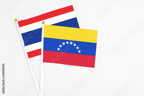 Free Download Venezuela and Thailand stick flags on white background. High quality fabric, miniature national flag. Peaceful global concept.White floor for copy space. - GFXLoad
