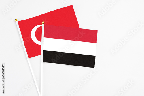 Yemen and Turkey stick flags on white background. High quality fabric, miniature national flag. Peaceful global concept.White floor for copy space. Free Download Yemen and Turkey stick flags on white background. High quality fabric, miniature national flag. Peaceful global concept.White floor for copy space. - GFXLoad