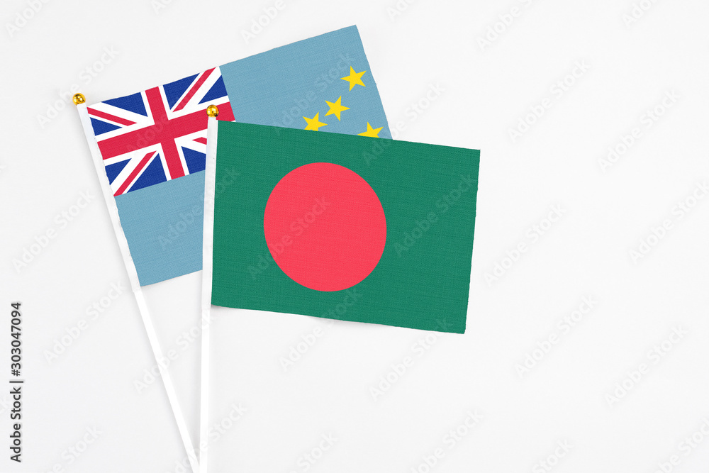 Bangladesh and Tuvalu stick flags on white background. High quality fabric, miniature national flag. Peaceful global concept.White floor for copy space. Bangladesh and Tuvalu stick flags on white background. High quality fabric, miniature national flag. Peaceful global concept.White floor for copy space.