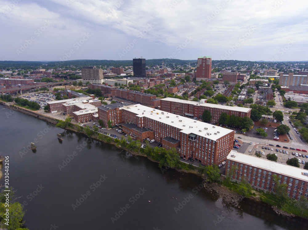 Manchester downtown building including City Hall Plaza and Brady Sullivan Plaza with Merrimack River in the front aerial view, Manchester, New Hampshire, NH, USA.