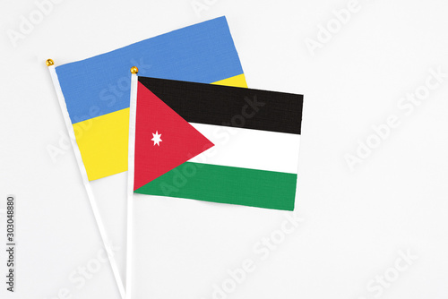 Free Download Jordan and Ukraine stick flags on white background. High quality fabric, miniature national flag. Peaceful global concept.White floor for copy space. - GFXLoad