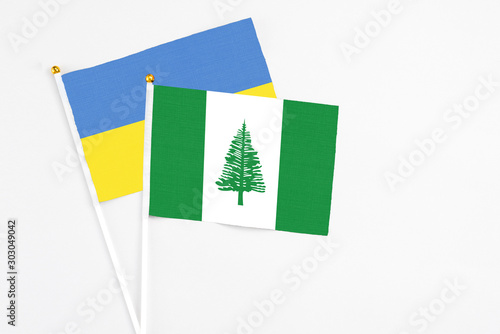 Norfolk Island and Ukraine stick flags on white background. High quality fabric, miniature national flag. Peaceful global concept.White floor for copy space. Free Download Norfolk Island and Ukraine stick flags on white background. High quality fabric, miniature national flag. Peaceful global concept.White floor for copy space. - GFXLoad