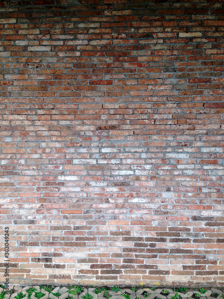 Naklejka premium Red bricks exposed wall material