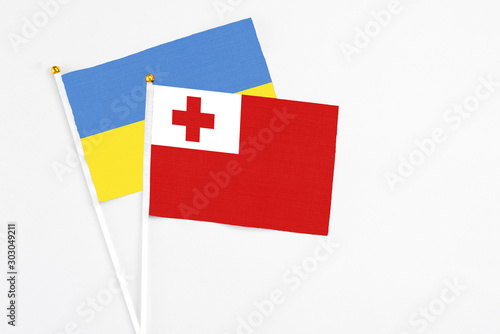 Tonga and Ukraine stick flags on white background. High quality fabric, miniature national flag. Peaceful global concept.White floor for copy space. Free Download Tonga and Ukraine stick flags on white background. High quality fabric, miniature national flag. Peaceful global concept.White floor for copy space. - GFXLoad