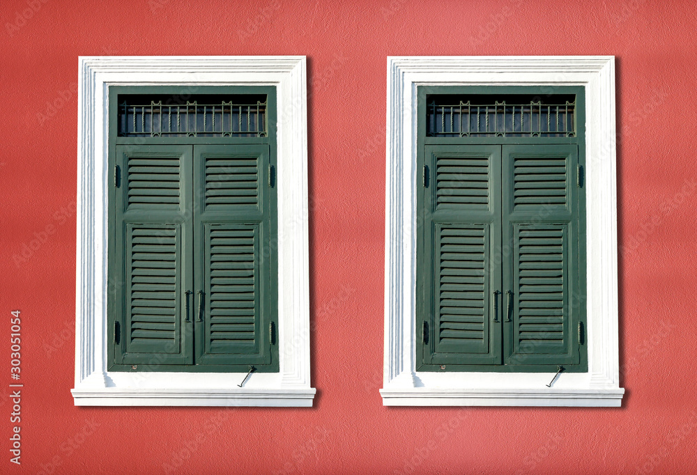 Traditional windows on bright red walls Traditional windows on bright red walls