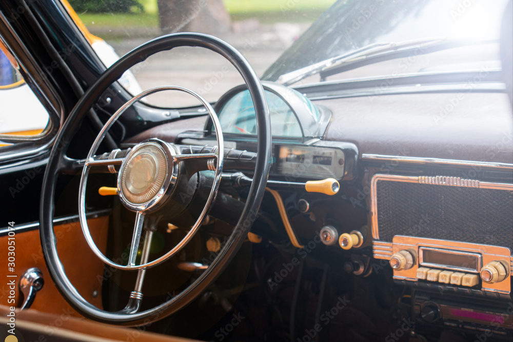 Vintage retro car interior. Old car steering wheel. Vintage retro car interior