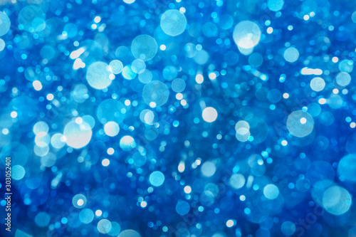 Abstract blue color bokeh. Christmas background