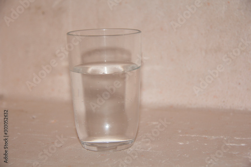 glass of water on blue background