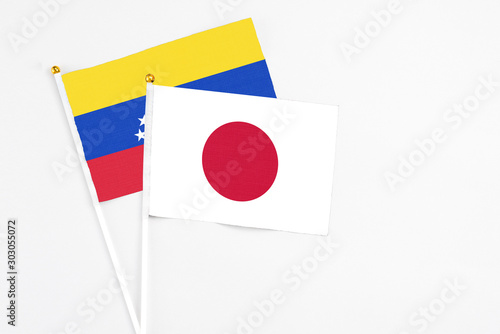 Japan and Venezuela stick flags on white background. High quality fabric, miniature national flag. Peaceful global concept.White floor for copy space. Free Download Japan and Venezuela stick flags on white background. High quality fabric, miniature national flag. Peaceful global concept.White floor for copy space. - GFXLoad