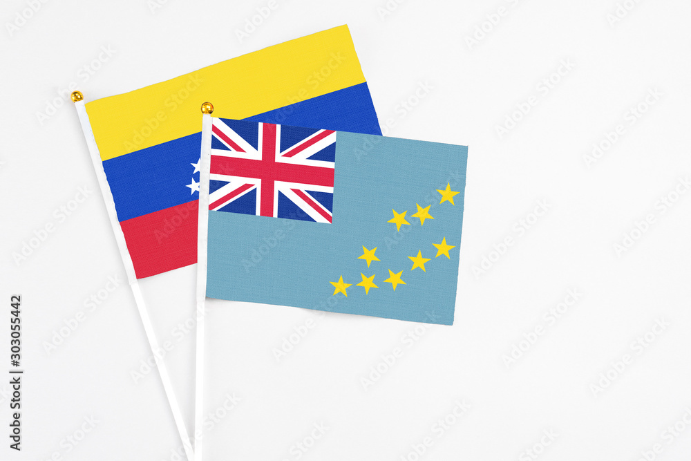 Tuvalu and Venezuela stick flags on white background. High quality fabric, miniature national flag. Peaceful global concept.White floor for copy space. Tuvalu and Venezuela stick flags on white background. High quality fabric, miniature national flag. Peaceful global concept.White floor for copy space.