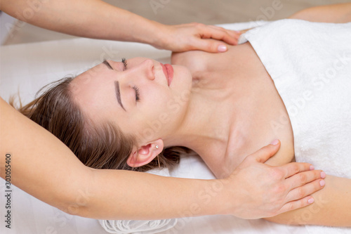 Massage and body care. Spa body massage woman hands treatment. Woman having massage in the spa salon for beautiful girl