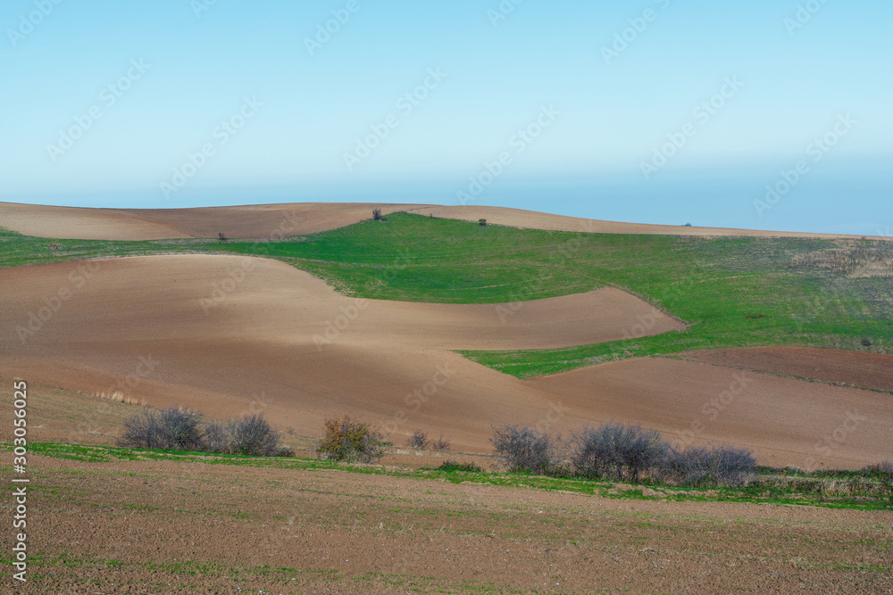 Panoramic view to plowed farm field Panoramic view to plowed farm field