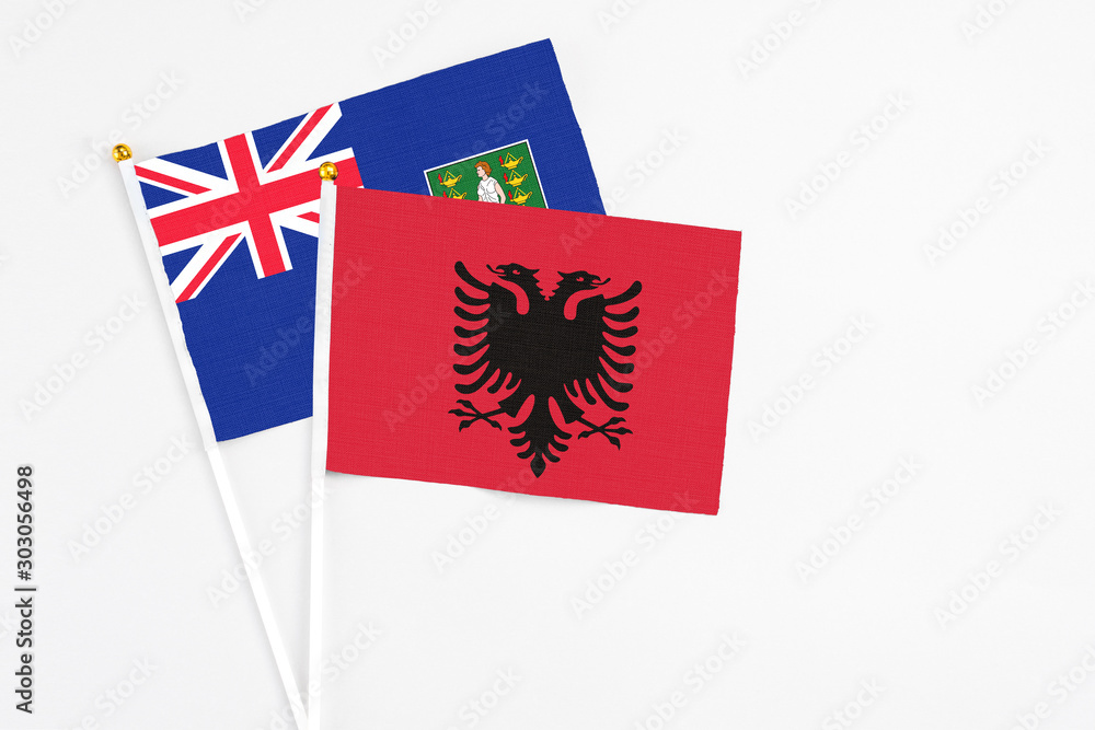 Albania and British Virgin Islands stick flags on white background. High quality fabric, miniature national flag. Peaceful global concept.White floor for copy space. Albania and British Virgin Islands stick flags on white background. High quality fabric, miniature national flag. Peaceful global concept.White floor for copy space.