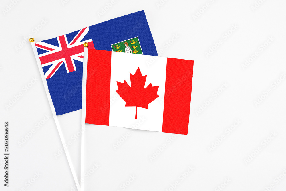 Canada and British Virgin Islands stick flags on white background. High quality fabric, miniature national flag. Peaceful global concept.White floor for copy space. Canada and British Virgin Islands stick flags on white background. High quality fabric, miniature national flag. Peaceful global concept.White floor for copy space.