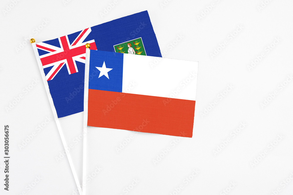 Chile and British Virgin Islands stick flags on white background. High quality fabric, miniature national flag. Peaceful global concept.White floor for copy space.