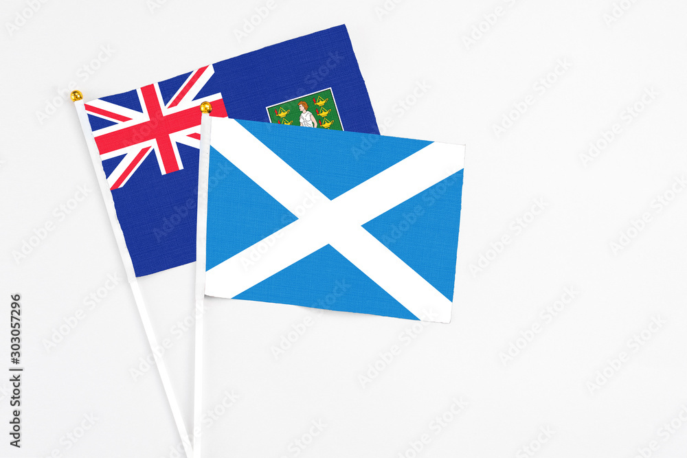 Scotland and British Virgin Islands stick flags on white background. High quality fabric, miniature national flag. Peaceful global concept.White floor for copy space. Scotland and British Virgin Islands stick flags on white background. High quality fabric, miniature national flag. Peaceful global concept.White floor for copy space.