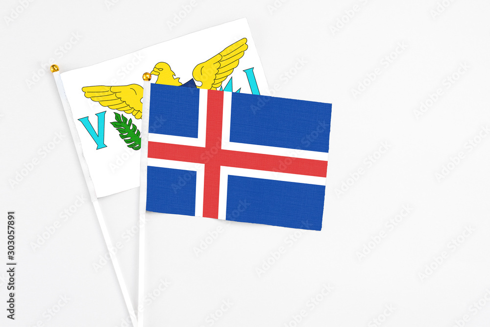 Iceland and United States Virgin Islands stick flags on white background. High quality fabric, miniature national flag. Peaceful global concept.White floor for copy space. Iceland and United States Virgin Islands stick flags on white background. High quality fabric, miniature national flag. Peaceful global concept.White floor for copy space.