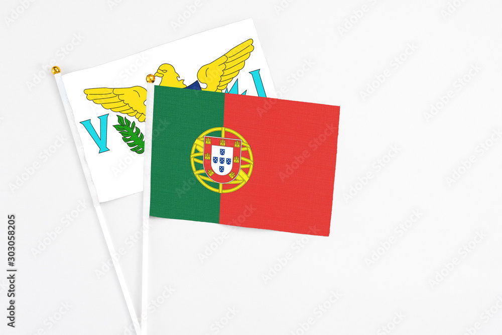 Portugal and United States Virgin Islands stick flags on white background. High quality fabric, miniature national flag. Peaceful global concept.White floor for copy space. Portugal and United States Virgin Islands stick flags on white background. High quality fabric, miniature national flag. Peaceful global concept.White floor for copy space.