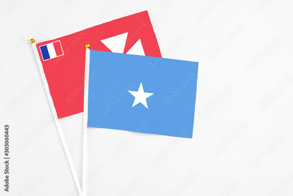 Somalia and Wallis And Futuna stick flags on white background. High quality fabric, miniature national flag. Peaceful global concept.White floor for copy space. Somalia and Wallis And Futuna stick flags on white background. High quality fabric, miniature national flag. Peaceful global concept.White floor for copy space.