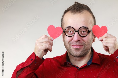 Man in love holding hearts