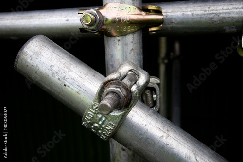 Galvanised steel scaffolding coupling connection on construction site 