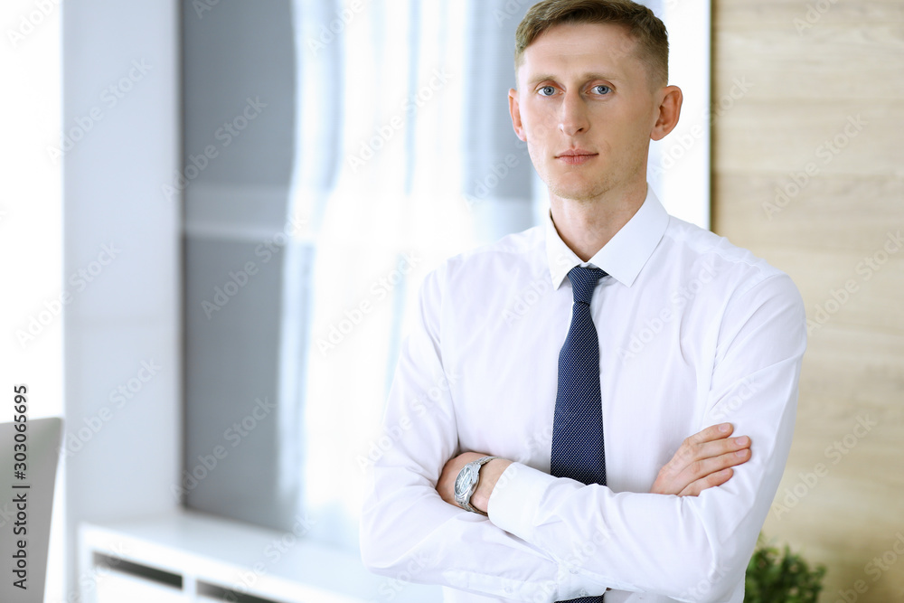 Businessman headshot. Entrepreneur at work at modern office Businessman headshot. Entrepreneur at work at modern office