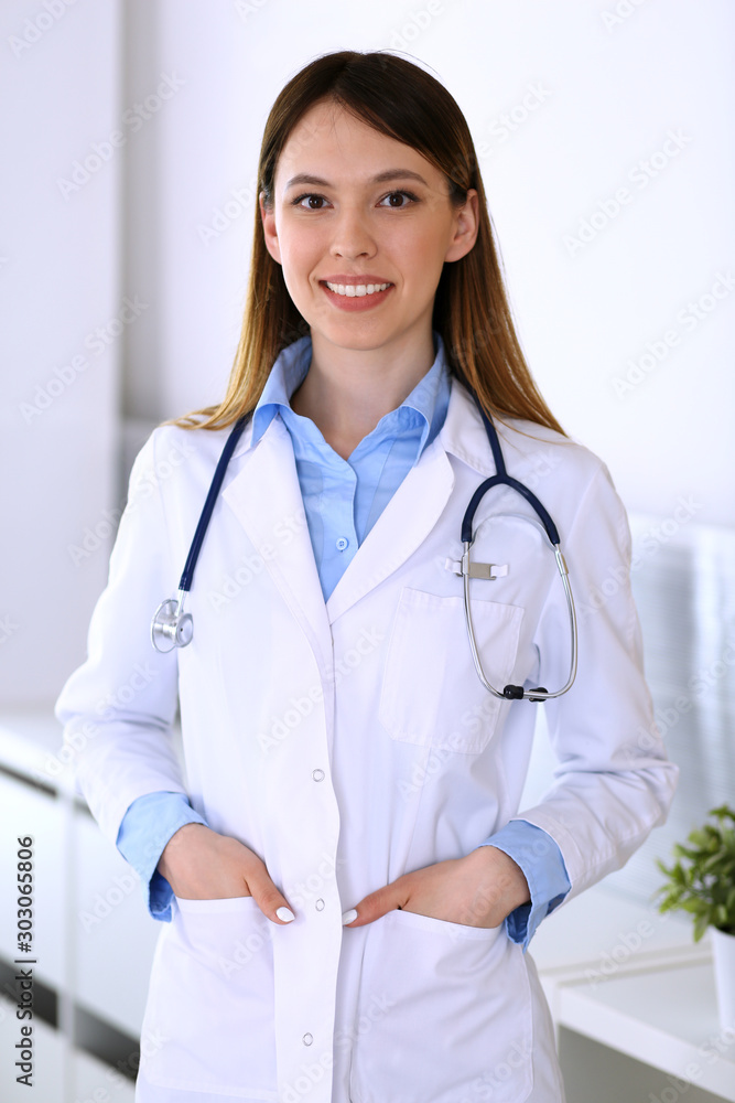 Asian doctor woman happy and cheerful while standing in hospital office. Medicine and health care concept Asian doctor woman happy and cheerful while standing in hospital office. Medicine and health care concept