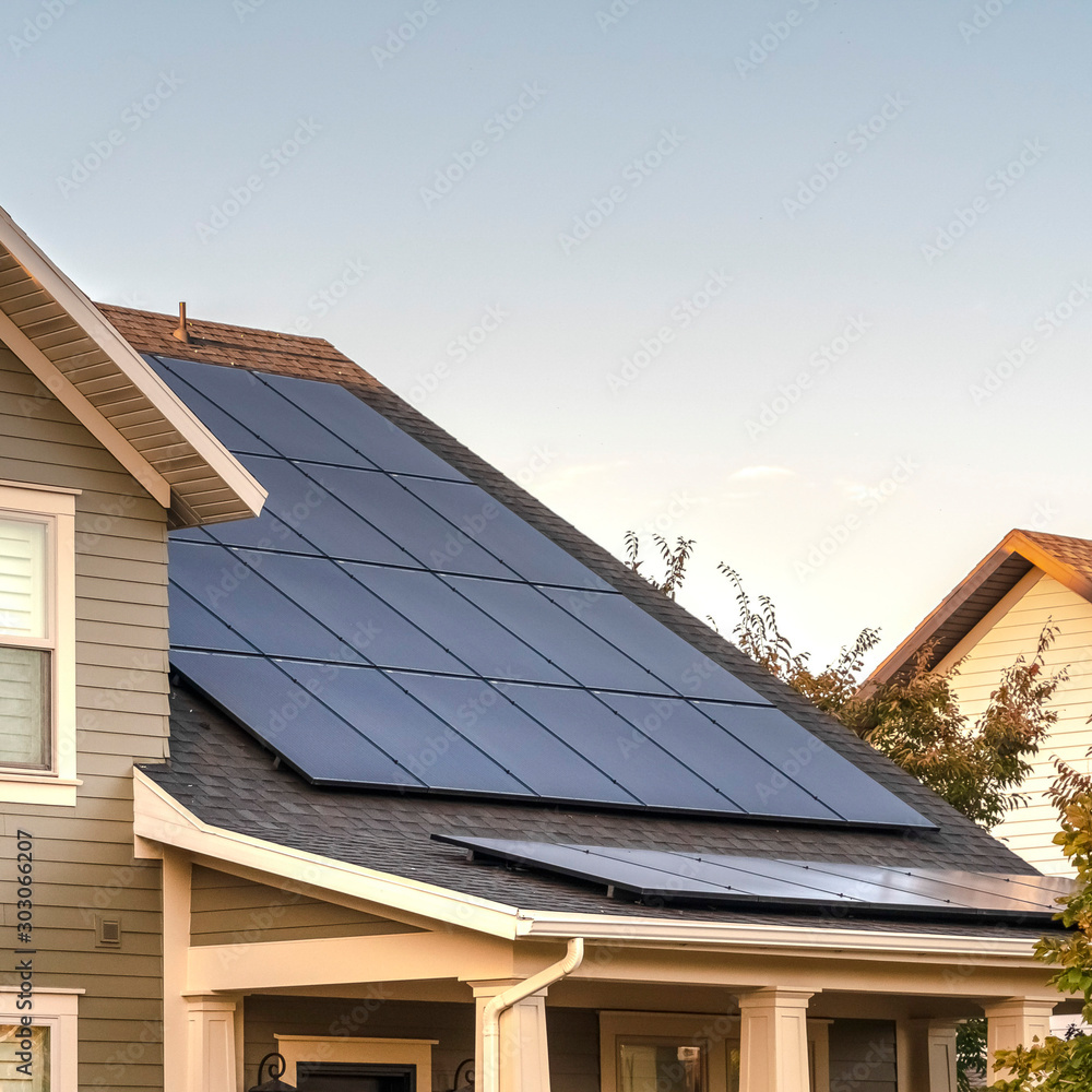 Square Solar photovoltaic panels on a house roof - obrazy, fototapety, plakaty 