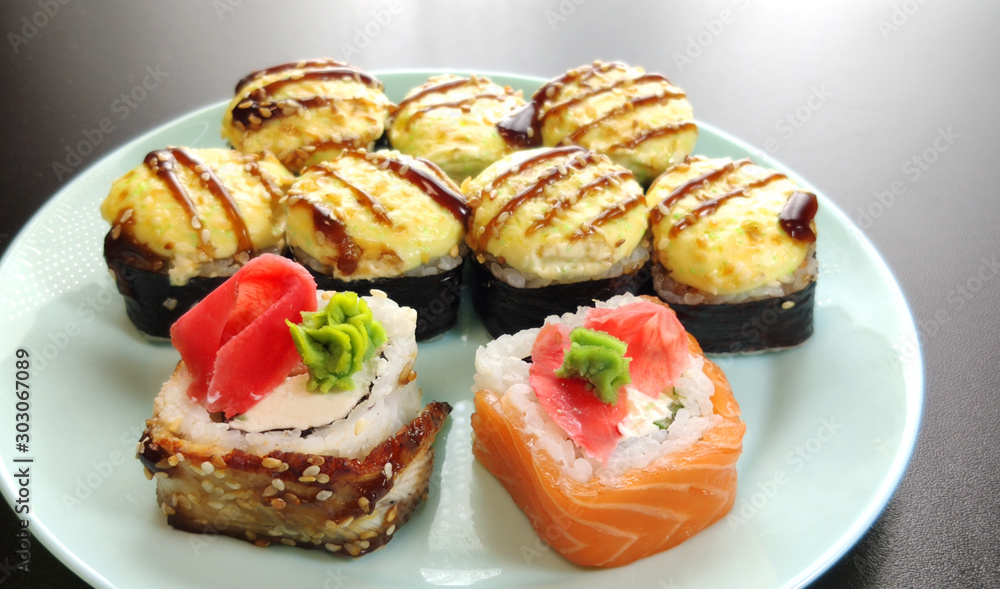 Variety of japanese sushi rolls. Sushi roll set on a plate.