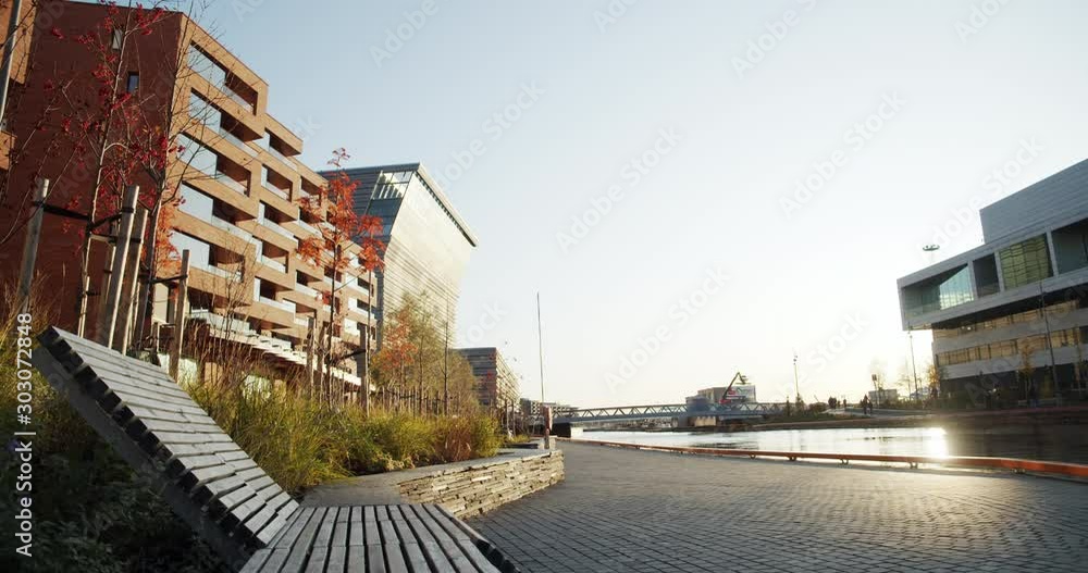 4K low angle wide shot with backward slide motion of Lambda, the new Edvard Munch museum, with famous paintings like Evening on Karl Johan, in an autumn sunset in the Bjørvika quarter in Oslo, Norway. 4K low angle wide shot with backward slide motion of Lambda, the new Edvard Munch museum, with famous paintings like Evening on Karl Johan, in an autumn sunset in the Bjørvika quarter in Oslo, Norway.