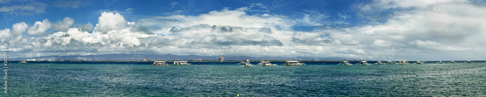 Panoramic seascape wit boats on the horizon