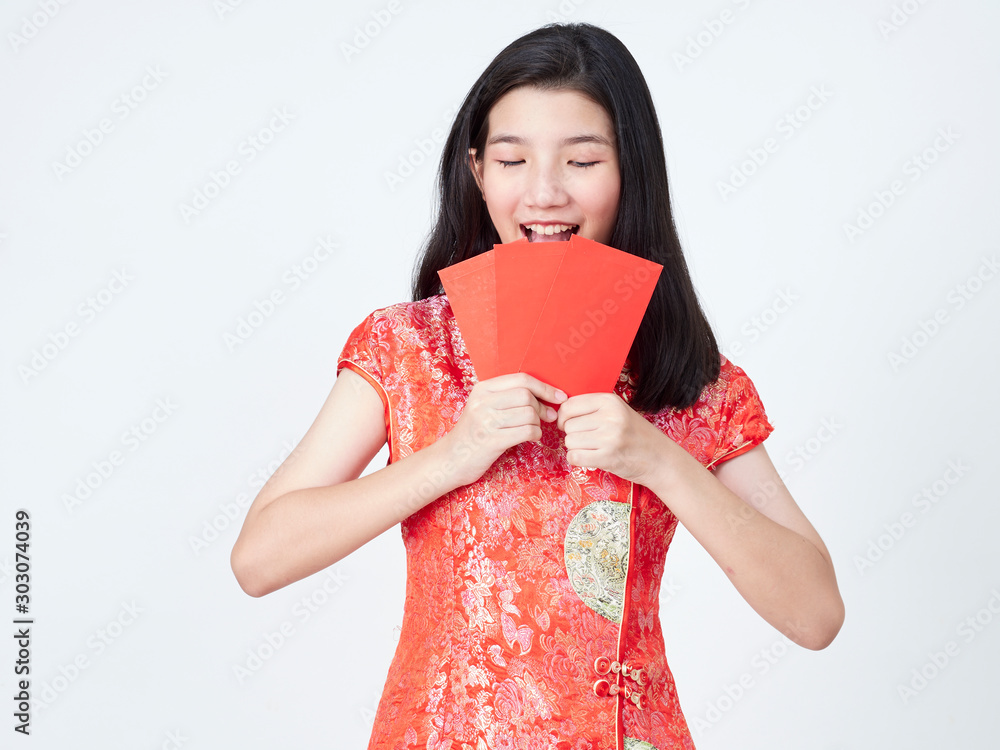 Woman in traditional chinese dress holding red envelope Woman in traditional chinese dress holding red envelope