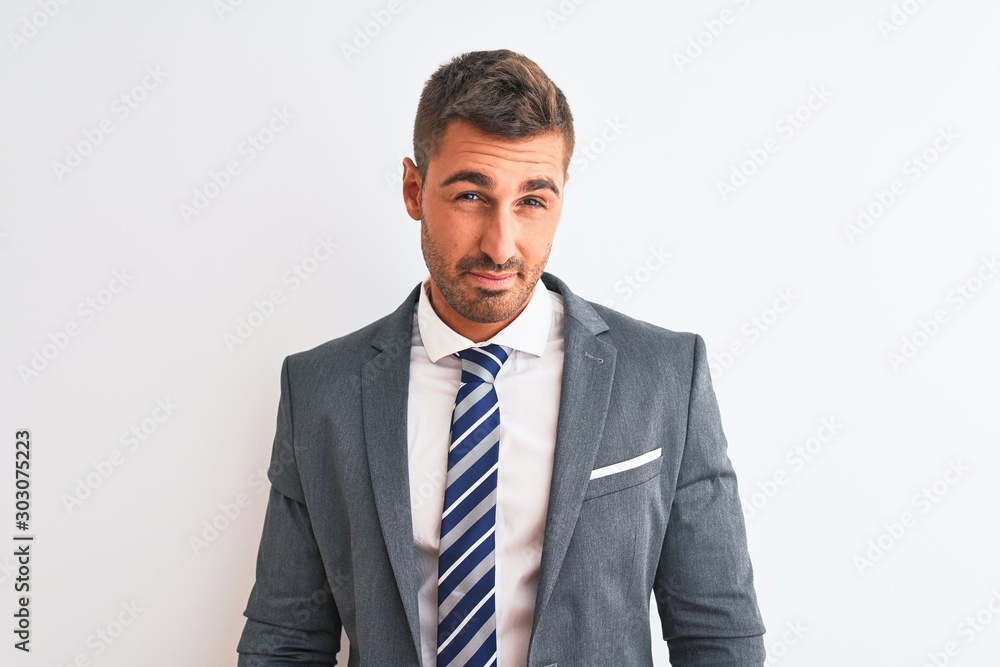 Young handsome business man wearing suit and tie over isolated background looking sleepy and tired, exhausted for fatigue and hangover, lazy eyes in the morning. Young handsome business man wearing suit and tie over isolated background looking sleepy and tired, exhausted for fatigue and hangover, lazy eyes in the morning.