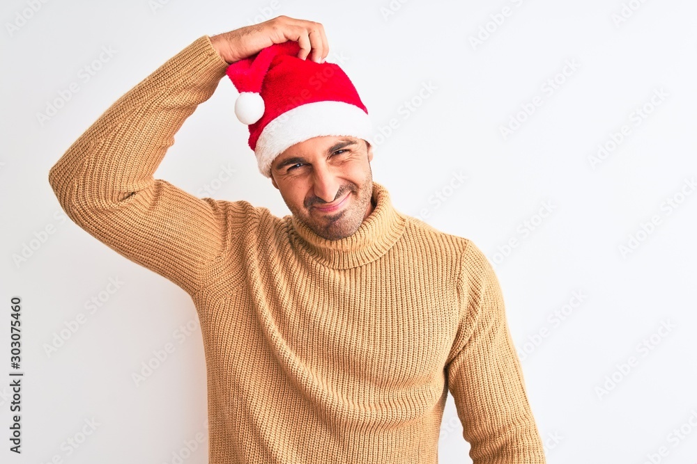 Young handsome man wearing christmas and turtleneck sweater over isolated background confuse and wonder about question. Uncertain with doubt, thinking with hand on head. Pensive concept. Young handsome man wearing christmas and turtleneck sweater over isolated background confuse and wonder about question. Uncertain with doubt, thinking with hand on head. Pensive concept.