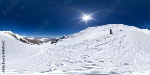 Spherical panorama of the Pamir mountain. Slope of Lenin Peak to an altitude of 5000 meters. Spherical panorama 360 degrees 180 Mountain hiker to climb a mountain of snow couloir.