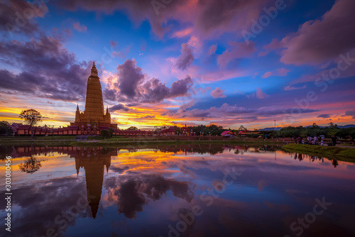 "Wat Mahathat Watchiramongkhon" or "Wat Bang Thong", it is beautiful Buddhist Temple during sunset time, standing at an impressive 70 meters in height it’s central tower at Ao Luek, Krabi, Thailand © Jack
