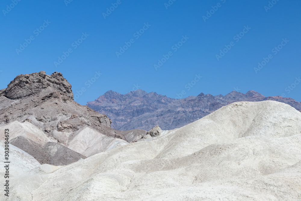 White rock formations etched against a clear blue sky in Death Valley National Park in California, USA White rock formations etched against a clear blue sky in Death Valley National Park in California, USA